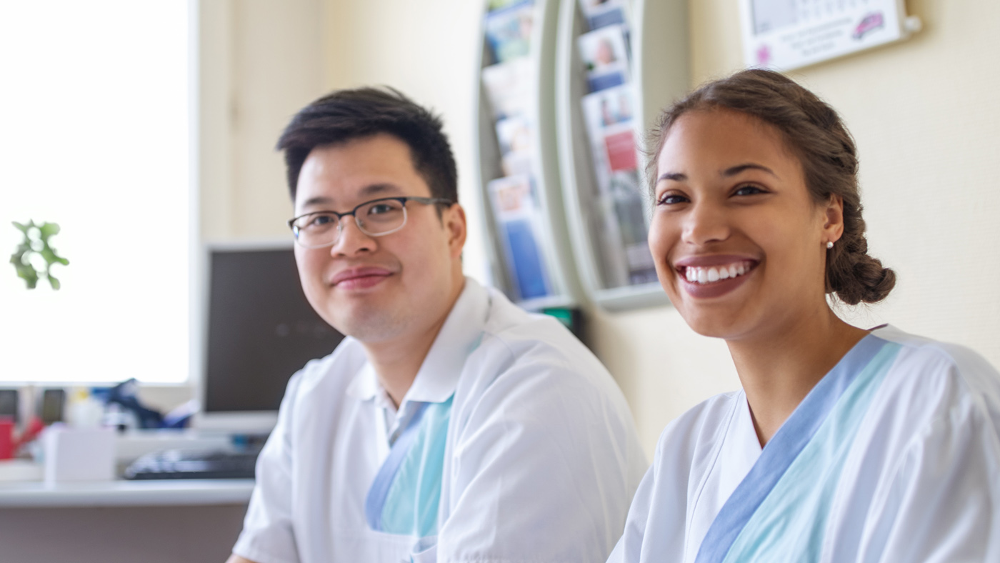 Two young medical professionals on a break at the hospital